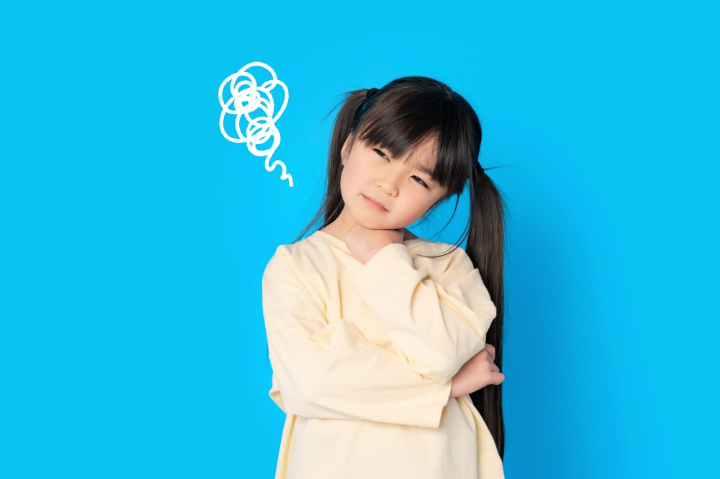 床矯正中に痛みを感じるのはどうしてか考える子ども